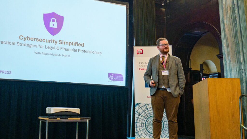 Adam giving a talk about cybersecurity at the ILFM conference in The Law Society hall, London.